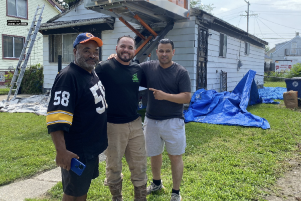 From left to right : Revels ,Ruben Gonzalez from AIS Construction, Hamtramck Police Chief Jamiel Altaheri